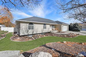 View of front of home with a garage, roof with shingles, and concrete driveway