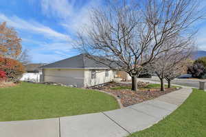 View of home's exterior with brick siding and stucco siding