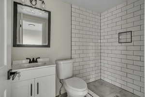 Bathroom featuring vanity and a stall shower