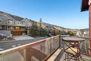 Balcony with a residential view and a mountain view