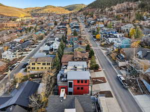 Aerial perspective of suburban area with a mountain backdrop