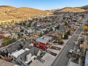 Aerial view of residential area featuring a mountainous background