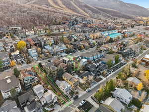 Aerial view of property and surrounding area featuring nearby suburban area and property parcel outlined