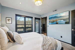 Bedroom featuring wood finished floors and recessed lighting