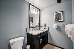 Bathroom featuring vanity and toilet