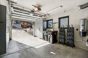 Garage featuring a central vacuum unit and a garage door opener