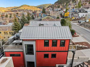 Aerial view of residential area featuring a mountainous background