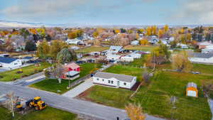 Aerial perspective of suburban area featuring a mountain backdrop