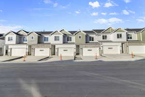 View of front of property featuring a residential view and stone siding