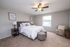 Bedroom with carpet flooring and a ceiling fan