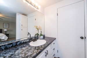 Bathroom with vanity and ensuite bathroom