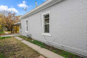 View of side of property featuring brick siding
