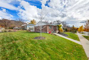 Side view of home with a mountain view