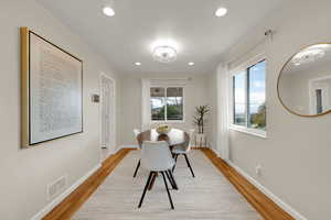 Dining room featuring a chandelier, recessed lighting, and light wood finished floors