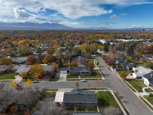 Aerial view of property's location with mountains and nearby suburban area