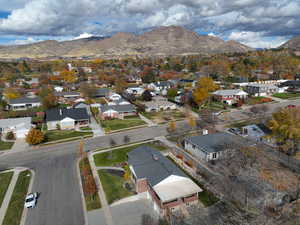 View of property location featuring a mountainous background and nearby suburban area