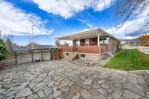 Rear view of house featuring a patio