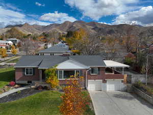 Aerial view of home with mountain view
