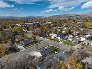 Aerial perspective of suburban area featuring a mountain backdrop