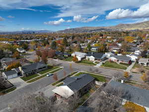 Aerial view of residential area featuring a mountainous background