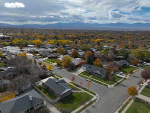 Aerial perspective of suburban area with a mountainous background
