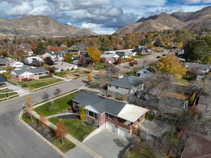 Aerial view of residential area featuring mountains