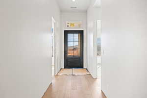 Doorway featuring hardwood / wood-style flooring
