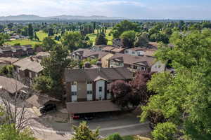 Aerial perspective of suburban area featuring a mountain backdrop