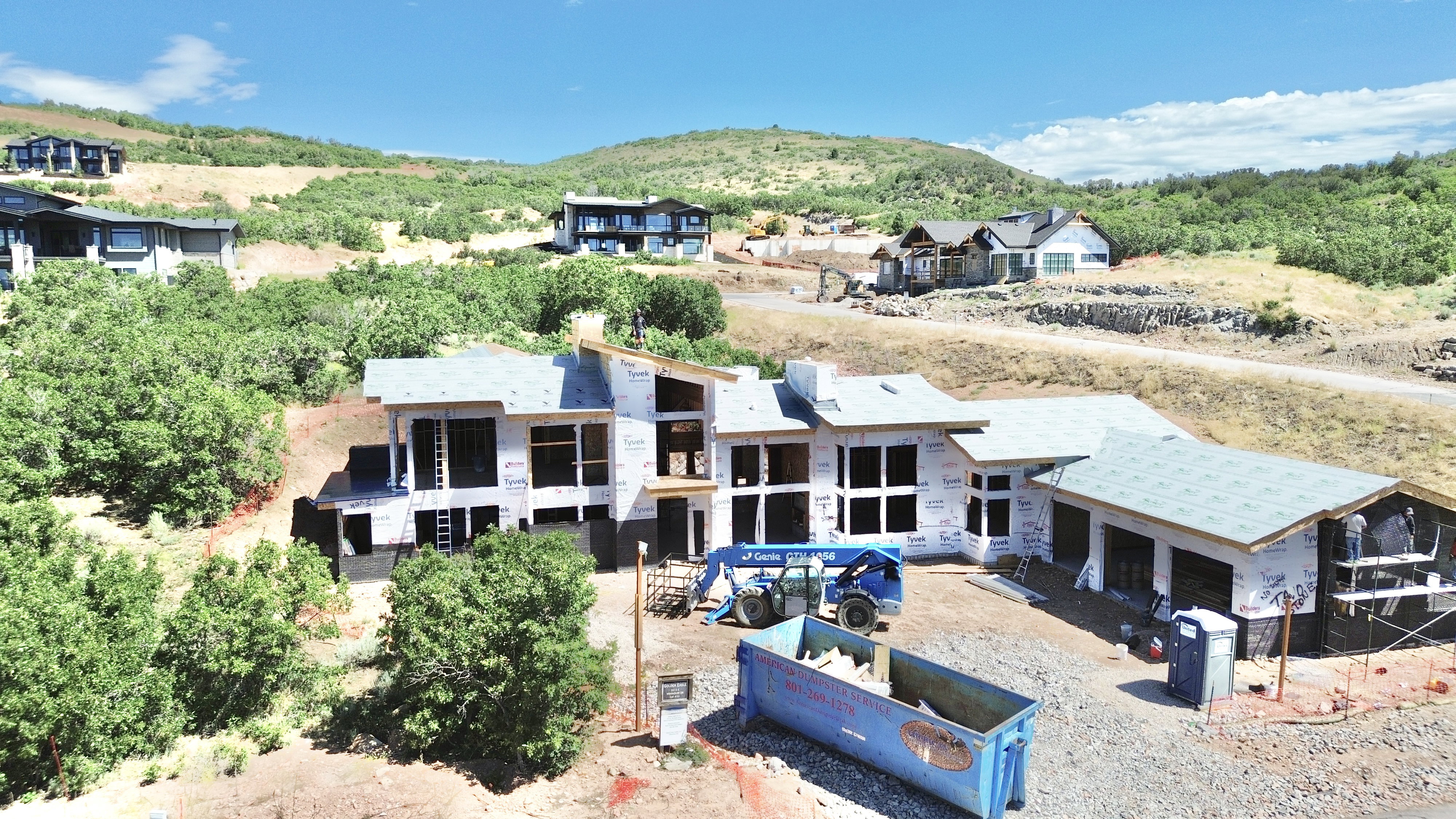 Expansive property site with a multi-level structure under construction