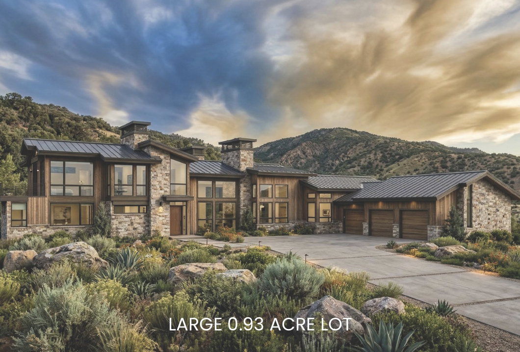 Contemporary home featuring a standing seam roof, stone siding, an attached garage, concrete driveway, and a chimney