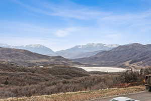 View of mountain backdrop with a large body of water