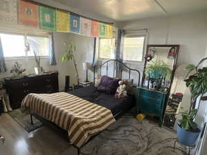 Bedroom with wood finished floors