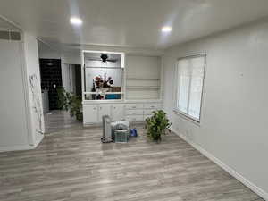 Unfurnished dining area featuring light wood finished floors and a ceiling fan
