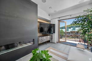 Living room with wood finished floors and a textured ceiling