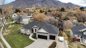 Aerial view of residential area featuring a mountainous background