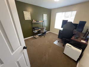 Office space with carpet floors and baseboards