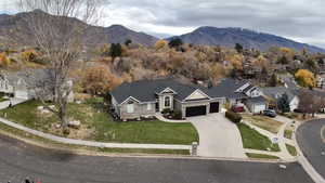 View of property location featuring a mountain backdrop and nearby suburban area