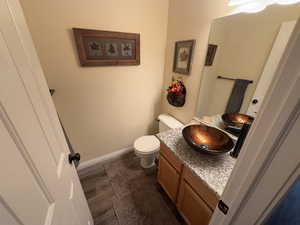 Bathroom featuring vanity and baseboards