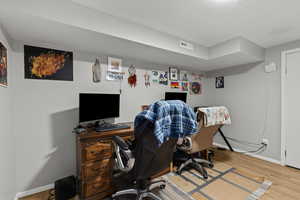 Office area featuring wood finished floors
