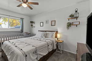 Carpeted bedroom and ceiling fan