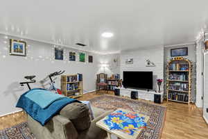 Living room with light wood finished floors and baseboards