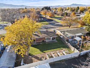Aerial view of residential area featuring a mountain backdrop