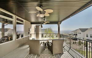 Spacious exterior balcony with trex decking and double fans.