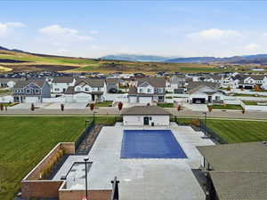 Community pool featuring a residential view, a patio area, and a mountain view