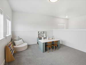 Office space featuring light carpet