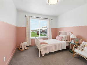 Carpeted bedroom featuring baseboards