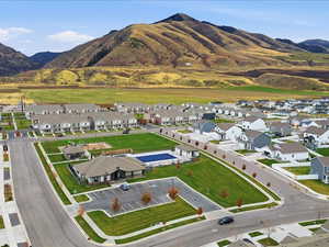 Aerial overview of property's location with nearby suburban area and a mountain backdrop