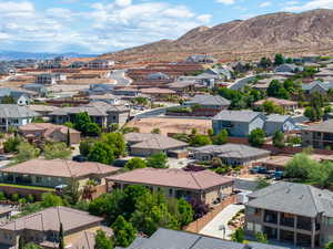 Aerial view of residential area featuring a mountain backdrop