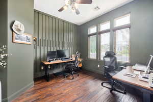 Office area with dark wood finished floors and ceiling fan