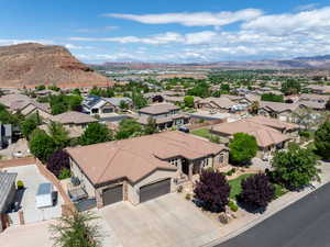 Aerial view of residential area featuring a mountain backdrop